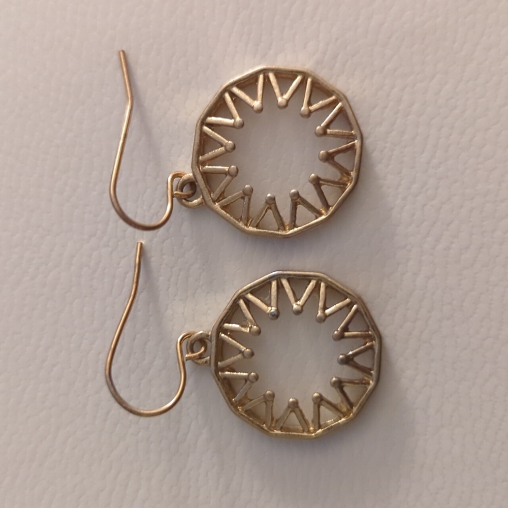 Gold colored sun earrings